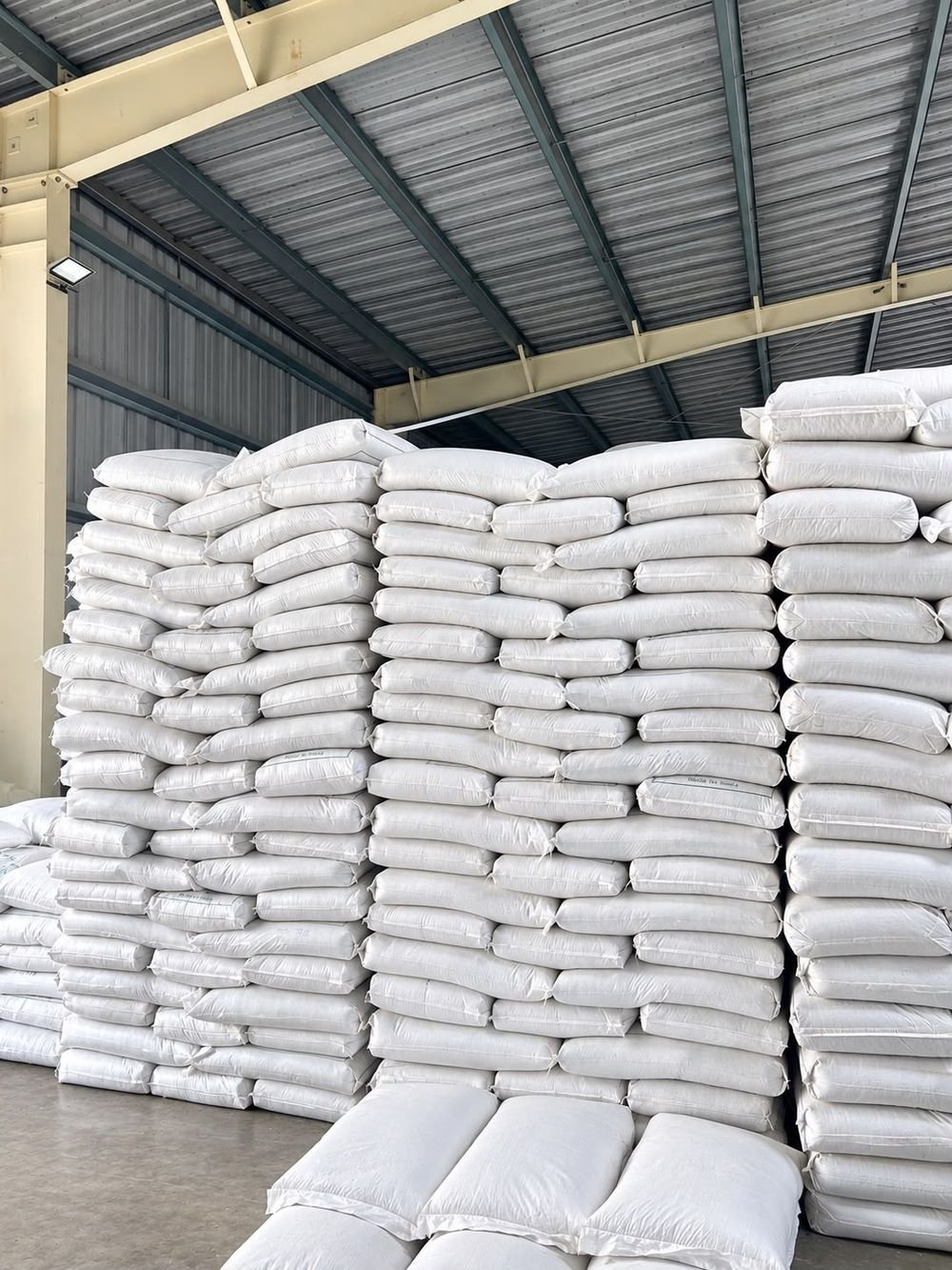 Bagged recycled polyethylene granules stacked in the Gidiya Polytech finished goods store